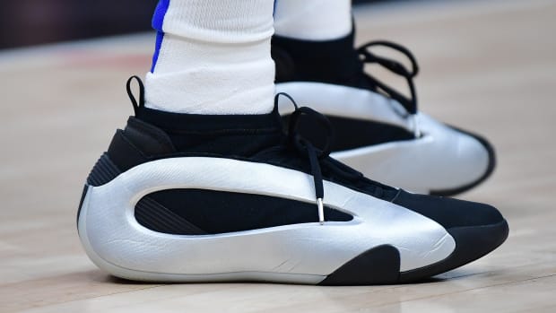 Los Angeles Clippers guard James Harden's silver and black adidas sneakers.